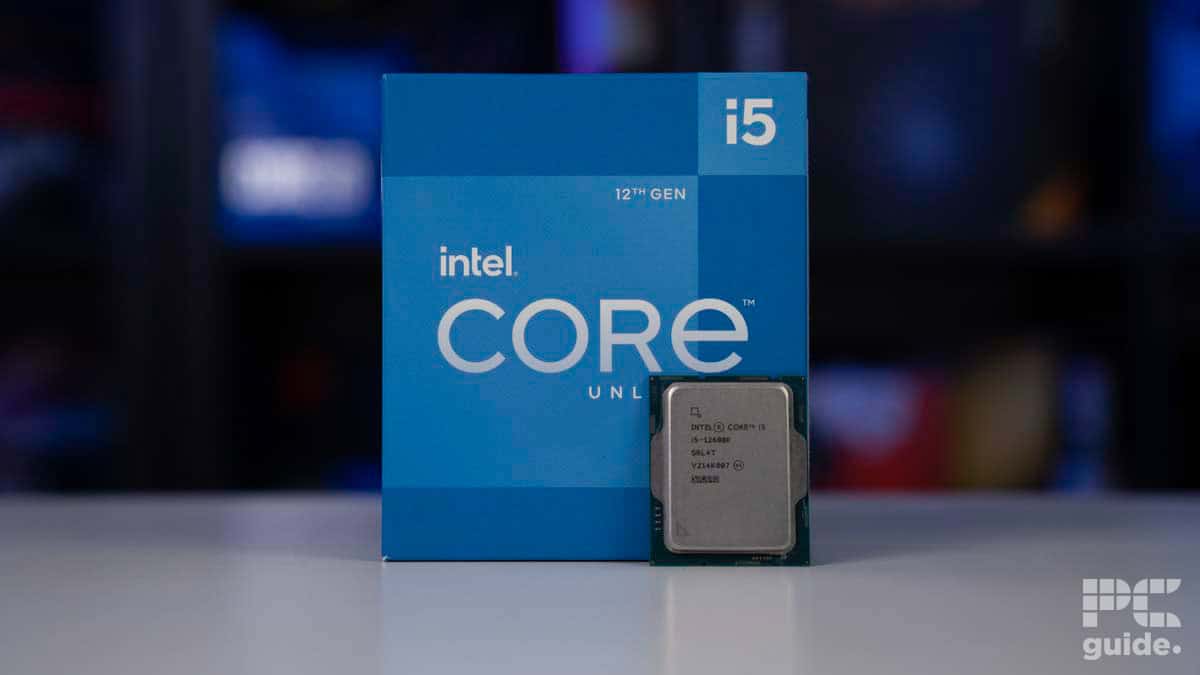 An Intel Core i5-12600K processor with its retail box displayed on a desk with a blurred background.