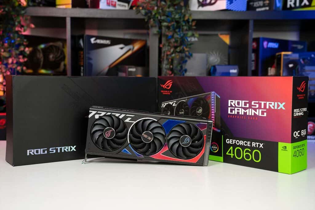 A variety of graphics card boxes, including an asus rog strix and an nvidia geforce rtx 3070, displayed on a shelf with colorful lighting in the background.