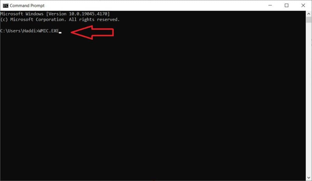 Command prompt window open on Windows 10, displaying a file path and an arrow pointing to "wmic.exe" text used to query the number of CPU cores.
