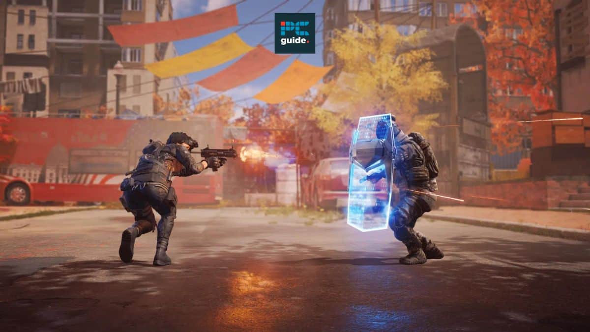 Two armored soldiers engage in a gunfight on a city street. One fires a rifle, while the other blocks with a glowing shield. The background shows a bus and buildings with autumn foliage, creating an intense scene that feels like XDefiant crashing on PC during peak action moments.