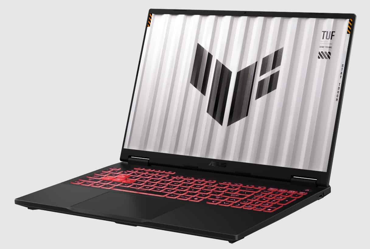 A gaming laptop with a corrugated metal design on the lid and a red-backlit keyboard. The lid has the TUF branding and geometric logo. The screen is on, displaying a neutral gray background. Inspired by Computex trends, this Asus gem exemplifies the innovation of Copilot+ PCs.